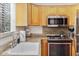 Bright kitchen with granite countertops, stainless steel appliances and garden view at 4620 N 68Th St # 166, Scottsdale, AZ 85251