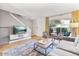 Stylish living room with natural light, a comfortable sofa, and sliding glass doors to the outside at 4620 N 68Th St # 166, Scottsdale, AZ 85251