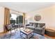 Inviting living room with comfortable seating, sliding glass doors, and a serene atmosphere at 4620 N 68Th St # 166, Scottsdale, AZ 85251