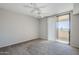 Spacious bedroom with sliding glass door leading to an outdoor patio and ceiling fan at 4925 E Desert Cove Ave # 326, Scottsdale, AZ 85254