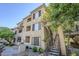 Beige two-story building with a stairwell and drought-resistant landscaping and a BBQ at 4925 E Desert Cove Ave # 326, Scottsdale, AZ 85254