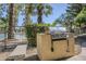 Gas barbecue grill on a stone base, perfect for outdoor cooking near the pool and seating areas at 4925 E Desert Cove Ave # 326, Scottsdale, AZ 85254