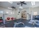 A community gym with various exercise equipment, mirrors, ceiling fans, and rubber flooring at 4925 E Desert Cove Ave # 326, Scottsdale, AZ 85254