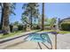 Outdoor hot tub surrounded by green landscaping and palms, providing a relaxing retreat at 4925 E Desert Cove Ave # 326, Scottsdale, AZ 85254