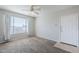Bright living room with neutral carpet, ceiling fan, and large window offers ample natural light at 4925 E Desert Cove Ave # 326, Scottsdale, AZ 85254