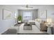 Bright living room featuring neutral tones, comfortable seating, and natural light from a large window at 4925 E Desert Cove Ave # 326, Scottsdale, AZ 85254