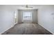 A cozy living room featuring neutral tones, a ceiling fan, and a door with natural light at 4925 E Desert Cove Ave # 326, Scottsdale, AZ 85254