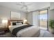 Serene main bedroom boasts soft lighting, sliding glass doors, and stylish decor at 4925 E Desert Cove Ave # 326, Scottsdale, AZ 85254