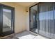 Private patio featuring neutral stucco walls, gray flooring, a glass slider and access to interior via solid door at 4925 E Desert Cove Ave # 326, Scottsdale, AZ 85254