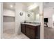 Bathroom features a granite countertop, double sinks, and neutral wall color scheme at 5079 E Emery Rd, San Tan Valley, AZ 85143