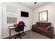 Flex bedroom with a window, pull-out couch, TV, and gaming chair at 5079 E Emery Rd, San Tan Valley, AZ 85143