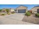 Attractive single-story home with desert landscaping, concrete driveway and an attached two-car garage at 5079 E Emery Rd, San Tan Valley, AZ 85143