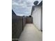 Narrow backyard space with cinder block fence and access to the main house at 5708 S Beck Ave, Tempe, AZ 85283