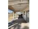 Covered backyard patio with ample space for outdoor furniture, offering shade and comfort for relaxation and entertainment at 5708 S Beck Ave, Tempe, AZ 85283
