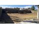 Large backyard featuring a mix of gravel and dry grass, surrounded by a fence for privacy and security at 5708 S Beck Ave, Tempe, AZ 85283