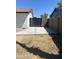 Backyard space with cinder block wall, fence, and dry landscaping at 5708 S Beck Ave, Tempe, AZ 85283