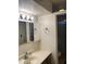 Bathroom featuring a vanity with a sink and mirrored cabinet, providing practical functionality and storage at 5708 S Beck Ave, Tempe, AZ 85283