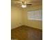 Bright bedroom with hardwood floors and a large window, creating a cozy and inviting atmosphere at 5708 S Beck Ave, Tempe, AZ 85283