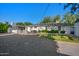 Wide backyard features gravel, grassy area, shady patio and seating at 5812 N 18Th Pl, Phoenix, AZ 85016