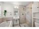 Stylish bathroom with a freestanding sink, glass-enclosed shower, and soaking tub at 5812 N 18Th Pl, Phoenix, AZ 85016