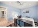 Bedroom offers a bright window, light blue walls, and a ceiling fan at 5812 N 18Th Pl, Phoenix, AZ 85016