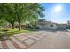 Attractive home featuring a well-maintained lawn, mature trees, and a decorative driveway at 5812 N 18Th Pl, Phoenix, AZ 85016