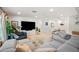 Elegant living room featuring modern decor, a large sectional, and ample natural light at 5812 N 18Th Pl, Phoenix, AZ 85016