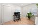 Bright office with wood floors features two monitors and a plant at 5812 N 18Th Pl, Phoenix, AZ 85016