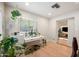 Bright office space with window, a view to the living room, and wood flooring at 5812 N 18Th Pl, Phoenix, AZ 85016