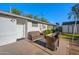 Back patio has outdoor seating, concrete slab, gravel, and access to the yard at 5812 N 18Th Pl, Phoenix, AZ 85016