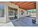 Covered patio with desert landscaping provides an area for outdoor entertaining and relaxation at 6623 N 85Th Ave, Glendale, AZ 85305