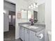 Bathroom showcasing double sinks, granite countertops, and neutral decor at 6623 N 85Th Ave, Glendale, AZ 85305