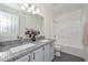 Bathroom featuring a double vanity with granite countertops at 6623 N 85Th Ave, Glendale, AZ 85305