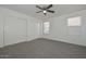 Bedroom featuring large sliding closet doors and windows, offering lots of space at 6623 N 85Th Ave, Glendale, AZ 85305