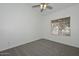 Bright bedroom boasts neutral carpet and a large window with neighborhood views at 6623 N 85Th Ave, Glendale, AZ 85305