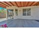 Covered patio featuring sliding glass doors and windows, ideal for enjoying the outdoors, with a concrete floor at 6623 N 85Th Ave, Glendale, AZ 85305