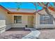 Inviting home entrance featuring a security door and well-maintained landscaping at 6623 N 85Th Ave, Glendale, AZ 85305