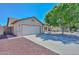 Charming single-story home with a two-car garage and mature landscaping at 6623 N 85Th Ave, Glendale, AZ 85305