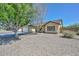 Charming single-story home with desert landscaping and a two-car garage at 6623 N 85Th Ave, Glendale, AZ 85305