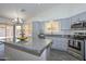 Modern kitchen featuring granite countertops, stainless steel appliances, and island at 6623 N 85Th Ave, Glendale, AZ 85305
