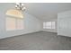 Open living room space with arch window and neutral carpet at 6623 N 85Th Ave, Glendale, AZ 85305