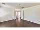 Bedroom featuring hardwood floors and two entrances leading to other rooms at 6830 W Desert Ln, Laveen, AZ 85339