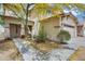 Charming two-story home featuring a covered entryway and well-maintained landscaping at 6830 W Desert Ln, Laveen, AZ 85339