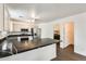 Modern kitchen with marble countertops, stainless steel appliances, and white cabinetry at 6830 W Desert Ln, Laveen, AZ 85339