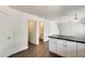 Modern kitchen with white cabinets and marble countertops at 6830 W Desert Ln, Laveen, AZ 85339