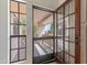 Close-up of glass doors leading to balcony view, with exterior walls in the background at 7800 E Lincoln Dr # 2092, Scottsdale, AZ 85250