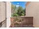 Close-up view of the balcony railing, with trees and other condo buildings visible in the background at 7800 E Lincoln Dr # 2092, Scottsdale, AZ 85250