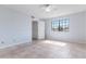 Bedroom featuring neutral tile flooring, ceiling fan, and a window at 7800 E Lincoln Dr # 2092, Scottsdale, AZ 85250