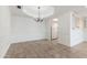 Open dining area with tile floors, elegant chandelier, and easy access to the adjacent kitchen space at 7800 E Lincoln Dr # 2092, Scottsdale, AZ 85250