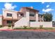 Charming condo with a red tile roof, well-maintained landscaping, and private balconies on a sunny day at 7800 E Lincoln Dr # 2092, Scottsdale, AZ 85250